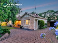 27 Albert St, Gumeracha SA 5233 $495,000 1465m2. Magnificent stone fronted 4 bedroom, 2 bathroom bungalow offering high quality living standards enhanced by many elegant features. Outdoor entertaining areas, double carport, large shedding and pretty gardens all on oversized allotment in popular township. LAND: 1465m2 (over 1/3 acre). The property, with its size and establishment, provides plenty to admire and appreciate, whilst allowing that little bit more extra space to use and benefit from that is over and above that which standard size blocks offer. At the front, irrigated gardens along with a screen of plants supported by a sandstone block retaining wall, give privacy to the home, with the green front lawn giving a beautiful contrast against the colours of the stone fronted home. The paved driveway passes the home on its way to the double carport and, in turn, the large garage / work shed. The rear gardens are best viewed from the raised entertaining deck where neatly established, colourful, irrigated gardens are the foreground to the large shade trees located closer to the back boundary. Perhaps just a stroll through grounds, listening and observing the birdlife which is understandably drawn to the property, is the way to appreciate this setting. Located in the always popular pretty hills township of Gumeracha, its position is convenient to the town’s facilities, including the Primary School and the nearby park, along with being a scenic 20 minute drive to Tea Tree Plaza. RESIDENCE: This 1930’s bungalow has been magnificently upgraded and is laden with a stylish elegance that has immense immediate appeal and will provide timeless admiration for its intending purchaser. Embraced by solid stone brick and underneath the renovated tiled roof is a home of generous proportions that offers high quality living standards. Stepping inside you are greeted by stunning timber floors that rest below high ceilings along with period architrave. These floors are also prominent in the living area where ornate ceiling roses and cornices are featured. A large slow combustion heater is recessed into the stone surround fireplace with mantle and gives a most welcoming winter warmth, whilst the ducted, reverse cycle heating and cooling system and split system unit give an abundance of instant year round comfort. The kitchen is spectacular with its offset tones of dark benchtops and high gloss, full height cabinetry. The stainless steel cooker with matching rangehood, the glass splashback, large fridge/freezer space, the wide breakfast bar, dishwasher and more are truly delightful. The home’s upgrade and extensions have seen the conversion of the original lounge to a new, very large, main bedroom with a gorgeous ensuite bathroom. The main bathroom has similar themes including floor to ceiling tiles, rainheads and both bathrooms are bright and superbly appointed. All four bedrooms have ceiling fans, with two of the large bedrooms having built-in robes. The second bedroom has its own external entry, making it ideal as an office or consulting room. The sunroom can be adapted to suit additional living, a commodious office, or a children’s playroom whilst enjoying the views over the rear garden. IMPROVEMENTS: The first of the outdoor structures is the raised entertaining area which has brick paving, timber balustrades and two sets of steps, along with shade screens and also has direct access to the living area. A second outdoor entertaining area is by way of the rear verandah. The double carport provides ample undercover parking and the largest of the structures being the 10.9m x 6.0m garage with its concrete floor, lockable roller door and 3 phase power making it a very purposeful workshop. With a separate matching garden shed with lockable roller door and a nearby rainwater tank that assists the gardens along with the mains water connection, there is much to love about this beautiful property.