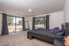 25 Peaceful Ln, Gidgegannup WA 6083 $699,000 Property Details Block Size 5 acres Zoning Rural Res Shire Rates $2,325 Description You can’t help but wonder why you would want to build when you can skip past all the stress and go straight to enjoying your brand new home. Built in 2016, this 4 bedroom 2 bathroom Redink home is superbly spacious with 3 separate living areas and large bedrooms to accommodate a growing family. Nestled on a 5-acre parkland cleared and pasture battle axe block, a fantastic semi-rural lifestyle awaits you in this friendly neighbourhood. 4 bedrooms 2 bathrooms 2016 Redink family home Expansive open plan living Deluxe theatre + activity Huge master w/ WIR + ens Large jnr bedrooms w/ BIR Gently elevated alfresco Parkland cleared + pasture 5-ac battle axe, rural view Friendly community locn Tucked away behind parkland timber, this battle-axe property is set in a rural pocket that is convenient for day-to-day life. A portico extends from the front of the home, welcoming you into the wide entry. The master suite is set to your right, offering sought-after separation from both the junior wing and living hub. The expansive space features a beautiful rural outlook, large walk-in robe and open ensuite. The ensuite is finished with dark décor and suggests sophistication and indulgence with double vanities, a double shower, large bath and separate wc. From the main entry, timber look flooring and high ceilings continue throughout the home, as does ducted reverse cycle air conditioning for optimal comfort all year round. Double doors open into the home theatre that offers itself as your new go-to spot for watching the latest releases. The hallway opens to unveil the spacious open plan living hub in the heart of the home. A long breakfast bar connects the kitchen to the lounge and dining whilst creating a convivial spot for casual meals and chit-chat when entertaining family and friends. Complete with a full suite of stainless steel appliances that include a 5-burner gas cooktop, wall-mounted electric oven, grill and dishwasher, it also boasts a huge walk-in pantry and handy IT recess. Sliding doors continue to the adjoining entertaining alfresco. Gently elevated over the rural vista and pasture beyond, this is a fantastic space for casual BBQ dinners or celebrations with friends and family. Glow in the dark quartz in the exposed aggregate concrete creates an otherworldly atmosphere at night. The junior wing offers fantastic separation for growing families, plus a third living area with a versatile activity space that could be used for kids to play, teens to study or young adults to retreat to. The three junior bedrooms are each a large queen size with mirrored built-in robes, making them rival some modern masters. The 5-acre property is part parkland clear and part pasture and offers itself as a blank canvas for your future vision. With plenty of room for livestock, a big shed or pool, you can establish it however you see fit! Set in the premium location of West Gidgegannup, this fantastic family home is in a friendly semi-rural neighbourhood. It’s an easy drive into the bustling Midland CBD and short commute to the endless delights of the Swan Valley for fun come the weekend. To arrange an inspection of this property or for friendly and honest assistance with any of your real estate needs call Mr Happy – Ross Webster – 0407 387 004.