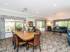 54 Tambulan Rd, Maida Vale WA 6057 $849,000-$899,000 The home was designed with entertaining in mind and offers a wonderful sense of space throughout the entire home especially the multiple living areas. The kitchen is central hub of the home and one of the highest traffic areas, with plenty bench and storage space, two wall ovens large pantry and dishwasher it is up to the task of withstanding the busiest of families. The lofty ceiling height through this open plan area consisting of family and meals and extends to a games room which also features a built in bar. These high ceilings also feature in the massive alfresco area which extends to almost the entire length of the home. Caf shade blinds can be rolled down to keep the elements at bay and make this the perfect entertaining area through all the seasons, regardless of how lengthy the guest list is. The formal lounge and dining although spacious provide a more private space. The entire home has reverse cycle air conditioning and cooling through the entire home, each member of the family can be comfortable all year around. This 5 bedroom 2 bathroom spacious home will suit the largest of families. The master bedroom and ensuite are located to the front of home and are both extremely spacious. Mum and dad have both been considered in this design with separate his and her walk in wardrobes and vanities. The four minor bedrooms are all double in size with, 2 have double wardrobes and 2 have walk in wardrobes. The amazing property sits on a massive 1801sqm; there are manicured gardens and a large grassed area perfect for tiring out children and pets, together with a garden shed, Hills Hoist and ample room to park all of the toys including boat, caravan and numerous cars. Another fantastic feature of this home is a brick powered workshop attached to the garage. This space has the potential to be used for a number of different activities depending on your individual needs. Perhaps a home office, art studio, granny flat, teenage retreat or even a home gym! If you have been searching for a large family home, great sized bedrooms on a big block in a great location then you have to come and view 54 Tambulan Road Maida Vale. BLOCK SIZE: 1801sqm AGE: 18 Years Old CONSTRUCTION: Brick and Tile INTERNAL FEATURES: 5 Bedrooms 2 Bathroom Home Formal Lounge and Dining Massive Kitchen, Meals & Family Room Games Room with Built in Bar Ducted Evap & Split System R/C A/C Ducted Gas Heating Extra High Ceilings Brick Powered Workshop Alfresco Entertaining Heaps of Parking Double Garage Reticulated Gardens Built in 1999, on a 1801 Sqm Block Features Air Conditioning Built-In Wardrobes Close To Schools Close To Shops Garden Secure Parking Formal Lounge