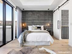 189 Princes StPort Melbourne VIC 3207 $1,850,000 - $1,950,000 Superb design and a magnificent interior are at the heart of this new rear north-facing town residence, where every luxury comes standard. Studio 35 Architecture has created a three-level home that excels with premium finishes and fixtures. The modern exterior reveals a wide entrance hall with two spacious ground-floor bedrooms one featuring a private landscaped courtyard and both bedrooms enjoying BIR’s and a central luxe sparkling bathroom. Up to the first floor, the living and dining spaces are either side of the high-end Corian kitchen, with Miele integrated refrigeration, two Vintec wine fridges, induction cooktop, and two ovens. Living room fitted with custom-designed entertainment unit with sliding doors opening to the balcony perfect for indoor/outdoor entertaining. Make your way up the timber staircase with concealed LED handrail lighting and arrive at the bespoke study area opening onto the north-facing terrace with breath-taking uninterrupted city views. The master bedroom retreat is positioned privately on the top floor. This zone is an everyday indulgence like no other, featuring clerestory timber-lined ceiling, pendant lighting and a state-of-the art ensuite. Watch the Spirit of Tasmania dock and depart from the front balcony. Be the first to call the spectacularly designed home yours with further highlights including, heated concrete and bathroom floors, each room with their own split system heating & cooling, matte black accents throughout the home for added sophistication, cleverly hidden laundry on the ground floor, secure home security system, planter boxes with self-watering system, ample storage and a remote garage. All of this just moments from Bay Street shopping precinct, Port Melbourne Beach and the Light Rail for easy CBD access.