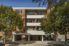 18/7 Curran St North Melbourne VIC 3051 Promising a carefree lifestyle, near vibrant city attractions, transport, Royal Childrens Hospital and University of Melbourne, this spacious two bedroom Hotham Hill apartment enjoys private, elevated rear aspect and Royal Park views. Offering appeal for both owner-occupiers and investors, it consists of freshly painted and carpeted open plan living, dining room, with balcony access, and a separate, previously updated kitchen with gas stove, dishwasher and scope to add your own style. There are two oversized bedrooms, with built-in-robes, original bathroom/laundry and separate toilet. In a well maintained block, secured by intercom/foyer entry, it includes split-system, storage and a car space on title. Zoned for University High and walking distance from Royal Park, shops, schools and trams, with Errol Street cafés, Queen Victoria Market, the CBD and CityLink all within easy reach.