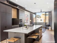 189 Princes StPort Melbourne VIC 3207 $1,850,000 - $1,950,000 Superb design and a magnificent interior are at the heart of this new rear north-facing town residence, where every luxury comes standard. Studio 35 Architecture has created a three-level home that excels with premium finishes and fixtures. The modern exterior reveals a wide entrance hall with two spacious ground-floor bedrooms one featuring a private landscaped courtyard and both bedrooms enjoying BIR’s and a central luxe sparkling bathroom. Up to the first floor, the living and dining spaces are either side of the high-end Corian kitchen, with Miele integrated refrigeration, two Vintec wine fridges, induction cooktop, and two ovens. Living room fitted with custom-designed entertainment unit with sliding doors opening to the balcony perfect for indoor/outdoor entertaining. Make your way up the timber staircase with concealed LED handrail lighting and arrive at the bespoke study area opening onto the north-facing terrace with breath-taking uninterrupted city views. The master bedroom retreat is positioned privately on the top floor. This zone is an everyday indulgence like no other, featuring clerestory timber-lined ceiling, pendant lighting and a state-of-the art ensuite. Watch the Spirit of Tasmania dock and depart from the front balcony. Be the first to call the spectacularly designed home yours with further highlights including, heated concrete and bathroom floors, each room with their own split system heating & cooling, matte black accents throughout the home for added sophistication, cleverly hidden laundry on the ground floor, secure home security system, planter boxes with self-watering system, ample storage and a remote garage. All of this just moments from Bay Street shopping precinct, Port Melbourne Beach and the Light Rail for easy CBD access.