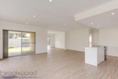 2 Croydon Street, Bellevue WA 6056 $419,000 Start writing your own page of history in this brand-new 2017-built, 3 bedroom, 2 bathroom family home. Elevated on Clayton Street, steps from the Heritage Trail, a Bellevue address offers the best of Foothills living with easy access to Midland and rail links to the Perth CBD. Surrounded by established easy-care gardens the home features quality fixtures and fittings, spacious open plan living, a bright modern colour scheme and high ceilings. 3 bedrooms 2 bathrooms Qualifies FHB 10K bonus Spick & span new home High ceilings open living Separate junior quarters Neutral colour scheme Estab easy-care gardens Big dble garage auto door Green title 536 sqm block Convenient Bellevue locn Enjoy the thrill of a brand-new home and access to the 10K FHB bonus – without the drama of building – in this bright, spacious and move-in-ready home. A wide entrance hall and 2.7 metre ceilings give an immediate indication of the modern, light-filled attitude of this home. An open-plan family, kitchen, living room allows for views to the garden and across to the reserve. The kitchen features a wide, practical, central island with breakfast bar, dishwasher and sink, while a 900mm oven and 5-burner hob ensure the family chef has all they need to prepare daily meals and special feasts. When you are ready to sit down with friends and family, sliding doors open to a covered alfresco area surrounded by lawn and low-maintenance gardens. The spacious master bedroom offers a sense of quiet luxury. Plush carpets, a walk-in robe, light-filled ensuite and separate W.C. shape a restful and inviting adults’ space. Arranged in a separate wing of the home are three junior bedrooms, all with carpets and full-height, built-in mirrored wardrobes. A genius floor plan for a growing family, this arrangement gives the kids to their own space and includes a study to allow them to complete homework without distractions. A family bathroom featuring unfussy, modern tiles and plenty of natural light and a walk-through laundry with a full-height double linen press complete this wing of the home. Outside a paved driveway leads to a large, two-car garage with automatic door and direct access to the home. Built on land that formed part of a large garden, the property feels well-settled in its site thanks to established tress having been retained. New plantings, lawn and paving around the perimeter of the home complete the picture. Something of a hidden Gem, Bellevue offers a Foothills location, easy access to the amenities of Midland and is within easy reach of arterial roads and rail links to the Perth CBD. Elevated with a great feeling of openness thanks to views of the Heritage Trail Reserve this new and shiny family home an invitation to a fresh start that is hard to resist.