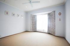 7 Roch Ct Ballan VIC 3342 Was $485,000 Now $480,000 Situated opposite scenic golf course - 3 Bedroom with BIR plus study - Main with ensuite - Bright bathroom with shower - Two living areas - Split system - Wood combustion heater - All electric oven - Down lights throughout - Drive through garage - Large fully fenced back garden Inspection by appointment only
