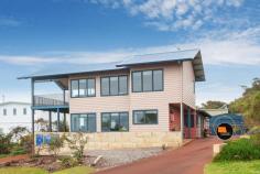 3 Galliers St Gracetown WA 6284 $1,335,000 Here is your chance to secure a fantastic family beach home perched high in Gracetown, with mesmerising elevated views of all the surf breaks within the Bay, including south towards the Ellen Brook stretch of coastline. Boasting a modern design and custom built by a reputable local builder this is a very attractive residence. Orientated to take advantage of the north facing solar passive aspect with outside living areas tucked out of the prevailing winds, this is a very inviting home to enjoy as a holiday house or comfortably as a permanent residence. Easily accommodate a large family and/or guests with dual living areas both upstairs and down. Featuring a master ensuite retreat upstairs equipped with a full kitchenette, open plan lounge/living which flows onto the elevated viewing balcony. Wake up to amazing ocean views from the bedroom, check all the surf breaks and ocean conditions before planning your day. From the second storey you can relax and watch the whales migrating with stunning views extending beyond the shipping lanes, simply mesmerising. Downstairs has a generous sized kitchen with functional open plan living areas that also take in ocean views. Three bedrooms, a well-appointed bathroom and easy care tile floor throughout make it an easy lock and leave. From inside you can also access the undercover outside area and both the rear and front yard separately. Enjoy the walk-in benefits of a fenced backyard and lockable large Colorbond shed, dual water tanks, solar panels and bituminised driveways. This property is well set up and ready to enjoy for generations of summers to come. An easy walk down towards the beach through the shortcut path at the end of Galliers puts you on Osborne St in no time, close to the shops and caf, no effort for the kids to walk to the surf or beach without having to get in the car. Property features: * Outstanding panoramic views * Locally designed and custom built * Dual kitchens (main downstairs and kitchenette upstairs) * Upstairs master bedroom with ensuite, open plan living, balcony to soak up spectacular panoramic views * Four bedrooms with master ensuite retreat * Modern bathrooms with separate w/c's * Fully fenced backyard, bituminised driveway * Secure Colorbond shed large enough for car and gear * Solar panels, dual water tanks * Reverse cycle air conditioning * Quiet street location * Great permanent or holiday residence * Short stay income potential, subject to Council approvals A contemporary beach residence, very well located with many features you wouldn't normally find in a Gracetown beach house worthy of your consideration. Contact David Cross your Gracetown Real Estate Specialist today on 0439 496 926 to organise a private inspection.