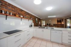 5 Cockatoo Cres Gooburrum QLD 4670 $389,000 LARGE FAMILY HOME IN TANTITHA ESTATE! SHEDS & POOL ON 1 ACRE…ALL UNDER $400,000!! Positioned on one acre in popular Tantitha Estate, is this large double brick home surrounded by a beautiful landscape of native trees and wildlife, just 7 minutes to Bundaberg’s CBD. An extremely sought after location, and a very rare opportunity to secure yourself a home with so many features, well under $400,000!! Offering a spacious floor plan, this home is perfect for the growing family. Provides two separate living areas, one as a formal lounge, the other an ideal entertainment room, complete with a built-in bar & a/c. The recently fitted designer kitchen brings light-filled tones to this space, and hosts an arrangement of cupboards & drawers. Down the eastern side of the home, you will locate all four bedrooms – the master suite has a walk-through robe, which enters into the two-way bathroom, a convenient setup for the entire family. You will also find a 2nd toilet near the laundry at the rear of the home, easily accessible from the second living area. The remaining bedrooms all have built-in cupboards & a/c and are complimented on their size. Dining out in Queensland has never been easier, especially when you have such an amazing outdoor space to utilise. Overlooking the self-cleaning salt water swimming pool, you can watch the children play whilst enjoying a barbecue breakfast. The pool area is screened for privacy via a large groomed hedge, and is complete with landscaped gardens and tiled surrounds. There is an abundance of yard space to add your very own touches, it really is a blank canvas for you to have your own fun! The welcoming entrance to the residence is a quality bitumen driveway, which leads you into the large 3 bay powered shed & convenient carport space. With median sale prices for the estate generally well over $400,000, we would suggest this is a diamond in the rough – now you have found it, the exploration is over & time for you to inspect!! Features Air Conditioning Built In Robes Dishwasher Outdoor Entertaining Pool - Inground Remote Garage Secure Parking Shed