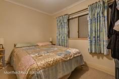 92 South Coast Hwy Orana WA 6330 $245,000 With six bedrooms, two living areas, a bigger-than-average block of 1121sqm and the convenience of a primary school across the road, this property is sure to be snapped up by a growing family. The fibro and Colorbond home still displays some of its original 1950s features, such as jarrah floorboards, timber window frames and high ceilings with decorative cornices, and it has been extended over the years to provide extra space. It is now a big home, ideal for families needing to accommodate a brood on a budget. The combined laundry and utility room has had a makeover and sports new tiles and built-in cabinetry, and the latest extension is a generous family area and dining room at the back. While the place would certainly benefit from further modernisation and the addition of a second bathroom, it is serviceable as it is, and would make an excellent starter property or one for the rental investor. Five of the six bedrooms are double sized and two have built-in robes, and there’s also a study or office at the front. In the original part of the house are the cosy lounge with a wood fire, and the kitchen with gas cooking and space for a meals table. The sunny family room has French doors to the extensive back yard. The garden is a kids’ paradise, mostly in lawn with various sheds, a shade house and raised vegetable beds as well as assorted fruit trees and a tall blue gum for shade. Alongside the house is a single garage with an adjoining workshop, both with power connected. There’s also off-road parking for three more vehicles. As well as Mt Lockyer Primary School just across the road, the high school and TAFE are also just 2km away – within easy walking or cycling distance – so school runs could be a thing of the past. A general store is a few doors away and a major supermarket and town are within a short drive. This property will appeal to those appreciating its potential for value-adding, its versatile quarter-acre block and the realistic price for this size. What you need to know: – Fibro and Colorbond home – 1121sqm block (quarter acre) – Some jarrah floors, high ceilings, timber windows – Six bedrooms, five doubles and two with built-ins – New laundry/utility room with built-in cabinetry – Bathroom – Lounge with wood fire – New family room and dining area – Kitchen with gas cooking and space for meals table – Garden mostly in lawn – Various sheds – Raised vegetable beds – Fruit trees – Garage with power – Workshop with power – Good off-road parking – Primary school just across the road – 2km from high school and TAFE – Five minutes to town, supermarket – Modernise and add value – Ideal rental investment