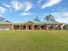 10-14 King Parrot Cl Boyland QLD 4275 $795,000 This home is offered for sale for the very first time. This beautiful home gives the feel of a manor as you drive through the gates. Every room in the home is large and even the linen press and storage cupboards are walk-in and with 9 foot ceilings there is definitely a grand feel to the home. This steel-frame, brick home with colourbond roof is set back from the road in one of the most prestigious areas in the valley. With a 5kw solar power system, solar HWS, a huge, in-ground rainwater tank, and 2nd smaller tank off the shed, this is a property that offers you the possibility of saving money and working with nature. The home has a north facing aspect and is insulated with ducted air-conditioning and ceiling fans throughout, these features plus the wood burning stove make the home really cool during summer and warm during winter. The tiled floors in the living areas, with feature insets, have a feel of luxury, with carpets in the lounge, bedrooms and media room for comfort. The custom built manor kitchen with regal features and appliances plus beautiful timber bench tops overlooks the main living area and compliments the luxurious feel of the home. The bathrooms are spacious and quality finished with high end fittings, floor to ceiling tiles, a large bath tub in the main bathroom and double basins and a double shower in the ensuite. The grounds are cleared, except for a grove of old eucalypts offering a great spot to picnic in the shade in your very own yard and the owners have been planting fruit trees around the property too. The garage, under the roof line, will house 2 cars, with remote control doors, and has a small storage nook to one side, offering an option to keep those things you want to have handy when going out in the car (prams, umbrellas, wheelchair, raincoats or picnic chairs, etc). The seperate shed offers 3 bays and a workshop to one side, just behind the house. It has the solar panels on the roof, and whirlybirds and insulation to help keep it cool. This would be a perfect workshop or a place to store those extra toys. The views from the front of the house capture Tamborine Mtn and overlook the expanse of your own front yard. The home is beautifully finished and presented. You must inspect this home today. It may well be the home of your dreams. Features Ducted Cooling Ducted Heating Open Fireplace Fully Fenced Outdoor Entertainment Area Secure Parking Shed Built-in Wardrobes Dishwasher Workshop Grey Water System Solar Hot Water Solar Panels Water Tank