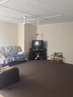 34 Wattle St Blackwater QLD 4717 $180,000 This three bedroom family home complete with huge 12m x 8m shed boasting power, tv & phone connections, whirly birds and big enough to house four cars would be appreciated in anyones standards. Cemented area between the shed and the house means entertaining is a breeze. Upon entering the 698sq m block you are impressed by the front deck, hedged surrounds and great car parking facilities. To one side of the home is a single carport with cemented area to fit a few more cars comfortably without even considering the huge shed out the front. Being a corner block you have fully cemented driveways to either street for ease of parking. Inside you are greeted by a large open plan living area cooled by two air conditioners, with new carpet flowing from the lounge down the hallway and into the bedrooms. The modern kitchen with ample bench space also has overhead cupboards to complement this area. The dining area is suitable for a large gathering with an office nook around the corner. A practical addition to any home. The double sink, wall oven, hotplates and rangehood with vinyl flooring finishes this area off nicely. The bathroom has a sliding glass door over the shower bath, white vanity unit and vinyl floor for ease of cleaning also to the separate toilet. Tiled flooring to the laundry area makes a statement in itself. This is a nice place to come home to with new interior paint, hallway cupboards, ceiling fans, verticals, air conditioning to two bedrooms with wardrobes to three, screens and exterior awnings for coolness.