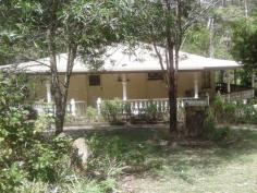 LOT 41 ENID COURT BLACKBUTT North QLD 4306 $240,000 Welcome to Gatana,- Meaning Spanish lady, this unique Octagonal home is set on 4.04 hectares of amazing gardens and bush-land. Featuring 3 bedrooms with built in robe's this property is truly set out to complement the shape of the house. Through the front entrance you step into the main living area, equipped with an open fireplace for those cold winter nights, from there you follow on through to the dining area where the remaining rooms run off the central gathering area. The kitchen features an old wood stove that runs hot water from it and the house is surrounded by an undercover porch area with beautiful concrete balustrades that run the whole way around the house. Off the beautiful shady porch you then step down into the undercover entertainment area, big enough to hold a small function. The area and its features complements the property and its surrounds. The gardens are a magical playground filled with garden paths and features at every turn, The Taromeo summer creek runs through the property creating the peaceful tranquility to get lost in as you walk around. The property is features a three bay parking area, chook house, storage shed, and an outside feature shed that would remind you of Holland. Alas, this property has been run down in recent years and needs TLC to get it back up to the beauty it is. But it has the potential for anything from a B&B, wedding venue or just simply make this your special home. Offers Over $240,000 Gatana is just waiting for you to explore.