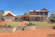 10 Tanjinn Street Dawesville WA 6211 Jo-Ann Yandle Presents . . . AWESOME ESTUARY VIEWS – BLUE CHIP LOCATION This well maintained and spacious 3/4 bedroom home set high on the hill in Tanjinn Street. Sweeping views far and wide of the pristine Peel Harvey Estuary will appeal to many. Relax out on the balcony and enjoy the views of the crystal blue waters and the boating activity on offer. Perhaps head out and catch some crabs for lunch or go for a spot of fishing. A paradise of activities await you. Meander along the pathways of the estuary or take a relaxing walk along the Dawesville Channel. This property has many features which include: * 3 bedrooms 2.5 bathrooms 3 wcs * One of the guest bedrooms has an ensuite bathroom, built in robes + ceiling fan * Master bed with walk in robe, ceiling fan and semi ensuite bathroom with corner spa, shower and vanity. * Separate guest quarters with evaporative air-conditioner and patio * Heaps of built in cupboards in main entry area. * Computer nook * Spacious modern renovated kitchen with waterfall edge bench-tops, gas hot plates, electric wall oven, dishwasher, microwave and large walk in pantry. * Dining, family room, kitchen with split reverse cycle air conditioner,ceiling fans and fire place. * Laundry area with vanity, shower and separate wc * Large front porch and paved sitting area. * Upstairs entertainment room with mini kitchen, feature timber floors and cathedral ceiling. * Timber balcony. * Double garage, paved driveway, gable patio for boat or extra vehicle. * Powered workshop. * Reticulated front and rear yard with garden shed. * 2 gas hot water systems * Sewer connected + Natural gas * Paved area at the front of the property for your caravan or extra vehicles. * Block size 956 sqm with 28.2 metre frontage.