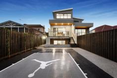 27A Houston Avenue Strathmore VIC 3041 Showcasing a superb spacious design, refined finishes, views across the rear open space reserve and impeccable inclusions, this new five bedroom plus study residence is ready to impress the executive family in style. Entertain with the multiple outdoor entertaining areas and a majestic half-court basketball arena built with multi-sport flooring as your backdrop from the elegant kitchen/dining/living and adjoining terrace. Luxurious expanses of stone features throughout the home are complimented by 3200mm ceiling heights and matched with custom 2-Pac satin matte black and oak kitchen cabinetry, dual pyrolytic ovens and induction cooktop by Asko, soft close drawers, integrated refrigeration, a built-in study nook and separate butler's pantry. Comprising five generously apportioned bedrooms, each with fixed robes, the star is a magnificent master on the ground floor which presents a walk-in robe and double shower ensuite. A second tasteful and completely tiled bathroom hosts a bath, frameless shower, toilet and custom Australian Marri Timber vanity tops, with the powder room and a large downstairs laundry and third bathroom being welcome inclusions. The study is fitted with built-in desks and joinery, and premier extras include Wi-Fi App in-ceiling speakers throughout, a lower level multi-purpose room with kitchenette and second undercover alfresco outdoor entertaining area. With an abundance of natural light throughout, the home includes central heating/cooling, intercom, ducted vacuum, security system and a large sub-basement 2 car garage and exceptional storage throughout. Moments to Napier Street shops and cafes, access to Essendon North Village, Strathmore College, Essendon Primary School, freeways, bus, trams and Strathmore/Glenbervie train stations.