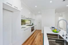 2/17 Lee Avenue Mount Waverley VIC 3149 Brand New Townhouse with Suburban Convenience Stunning contemporary design featuring spacious comfort, high ceilings, quality timber floors, tall windows, luxury fittings and a relaxed yet convenient lifestyle are the hallmarks of this sensational, brand new two level townhouse. Positioned in an enviable location within the Mount Waverley Secondary College School zone, this gem is literally metres to buses, trains, shops and eateries. Light filled, this double storey haven impresses with a generous lounge and dining zone along with a state of the art stone kitchen with stainless steel gas appliances, 5 burner cooker, deluxe window splash back, and an island bench with a dishwasher. The front study can be converted into an extra bedroom, offering options for a relaxing change of pace or a perfect spot to hustle and get things achieved. Neighbouring is a gorgeous lower level suite with a walk-in robe and a divine shower ensuite, while the upper master is spacious with a walk-in robe and ensuite and two further bedrooms with built-in robes. A pristine central bathroom boasts wall-to-wall shower and floating vanity and two powder rooms are a true treat. With fantastic outdoor entertaining options including an easy-to-manage courtyard and sun-drenched alfresco patio. This striking residence also comprises of a delectable sitting area, a large storage room under the stairs, a laundry, ducted heating, evaporative cooling, ducted vacuum and double remote garage with internal entry. In a superb location only seconds to Syndal train station, family amenities, restaurants, cafes, gymnastics and fitness centres, schools such as Huntingtower School, Wesley College, Mount Waverley Secondary College and Syndal South Primary along with the newly renovated The Glen shopping centre, Kingsway entertainment district and Cinemas.
