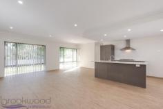 2/4 Russell Road Greenmount WA 6056 $429,000 Start writing your own page of history in this as-new, 3 bedroom, 2 bathroom, brick and iron family home. Set privately on an elevated battle-axe block with expansive views across adjacent parkland, the Greenmount address offers the best of Foothills living with easy access to city conveniences and hills attractions. Surrounded by easy-care gardens the home features spacious open plan living, a light, modern colour scheme, large rooms and high ceilings. Spick & span as new home 3 bedrooms 2 bathrooms Lrg study + sep junior wing High ceilings & open living Attractive colour scheme Fantastic alfresco UMR High double auto garage Private 553m battle-axe Elevated & adjoining park Close to schools & trails Enjoy the thrill of an as-new home – without the drama of building – in this bright, spacious and move-in-ready property. A wide entrance hall and high ceilings throughout give an immediate indication of the modern, light-filled attitude of this home. An open-plan family, kitchen, living room allows for views to the garden and across to the lush green treetops of the adjoining Fraser Park. Tucked in one corner of the open plan living is a separate theatre space, private enough for uninterrupted viewing, yet connected to the central living zone. The kitchen features a wide, practical, central island with breakfast bar, dishwasher and sink, while a 900mm oven, 5-burner hob and rangehood ensure the family chef has all they need to prepare daily meals and special feasts. When you are ready to sit down with friends and family, a sliding door opens to the covered alfresco area surrounded by lawn and low-maintenance gardens with park views. The spacious master bedroom offers a sense of quiet luxury. Plush carpets, a walk-in robe, light-filled ensuite and separate W.C. shape a restful and inviting adults’ space. Adjacent the master bedroom is a generously sized study that could easily be used as a 4th bedroom or nursery if required. Arranged in a separate wing of the home are the junior bedrooms, both with carpets and full-height, built-in, mirrored wardrobes. A genius floor plan for a growing family, this arrangement gives the kids their own space. A family bathroom featuring modern tiles and plenty of natural light and a walk-through laundry with storage complete this wing of the home. Outside a paved driveway leads to a large and much higher than standard, two-car garage with remote entry and direct access to the home. An elevated lawn – with attractive sandstone steps and retaining wall – and easy-care plantings along the front fence and down the driveway complete the picture. Something of a hidden gem, Greenmount offers a Foothills location with easy access to the amenities of Midland, the Perth airport and rail links to the CBD. Local schools are right on your doorstep and the Heritage Trail is just a few minutes walk away. Elevated with a great feeling of openness thanks to views across the park, this new and shiny family home is an invitation to a fresh start that is hard to resist.