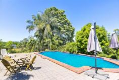 50 Elizabeth Street NAMBOUR QLD 4560 Huge block, huge home close to town. This delightfully large family home features open plan living with a mix of formal, casual and outdoor entertaining areas. The approx. 300m2 home offers 4 good size bedrooms, 2 bathrooms a large laundry with plenty of cupboard space and a walk in linen closet and that’s just the beginning. From the moment you walk through the over-sized entry way you will start to appreciate the size and space of this home. The formal lounge offers a great area for relaxing or could be used for an extra living area for the kids. The large 7m X 7.5m sunroom has views to the south and west through the abundance of windows that also flood the room in light. This room runs directly off the main living area of the home with plenty of room for a large dining table to seat the whole family and features a fireplace. The perfectly located kitchen offers a 5 burner gas cooktop, 900mm oven and double fridge space. Add to that the ample cupboards and extra deep bench tops makes this kitchen functional for the largest of families. Leading straight out from the kitchen is the covered patio with access to the large 65,000L pool, perfect for entertaining the family and friends. The immaculate elevated 2400m2 block features beautiful gardens, mature trees, garden sheds and a 5000L water tank. It also allows options to add a large shed or even a second dwelling permitting council approvals. This property has all the features you want for a grand family home and is located close to schools, shops and public transport and still only 20 mins to the beach. FEATURES • 5kw Solar • NBN available • Formal Lounge • Large Sunroom • Huge family pool with heating options • Large covered patio • Fireplace • Air conditioning • 900mm Gas cooktop • 2 Garden Sheds • 5000L Water Tank • 315l Hot water system • Huge 2400m2 block • Second dwelling options