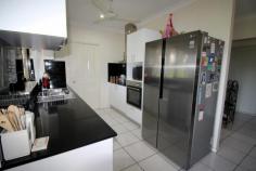 10 Francis Martin Street El Arish QLD 4855 $369,000 * Near new family home * 3 bay shed with separate caravan shelter * Energy Efficient Built in 2012, this fully fenced 3 bedroom, 2 bathroom family home on 903m2 is in excellent condition and located on a quiet and private street across the road from rainforest. The house has a great layout for a family with the main bathroom having a separate shower and bath. Step through the entry door into the formal living area, beyond this is an open plan kitchen, dining and living area with an adjoining shade cloth covered outdoor entertaining area. There’s an additional large covered outdoor entertaining area at the rear which runs the width of the house. To help with the cost of living, there’s a 2 solar panel hot water system. At the rear of the property you can find storage options for all your toys, including the boat, camper trailer and caravan. There’s a large 9m x 6m 3 bay shed with 2 garage door openings and 18 solar panels on the roof with a 3kw inverter. A large rain water tank. There’s plenty of space to store all your garden needs in a separate 3m x 3m garden shed. And to top it off, there’s a large covered 7.4m x 4.1m caravan shelter with a height of 3.6m at the apex and 3.1m high on the sides. This property is conveniently located within walking distance of local amenities including the Post Office, School, Tavern and the El Arish Golf Course. It’s only a short 15 minute drive to tropical Mission Beach where you can hop in your boat and head on over to Dunk Island or one of the other nearby local islands.