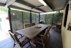 10 Francis Martin Street El Arish QLD 4855 $369,000 * Near new family home * 3 bay shed with separate caravan shelter * Energy Efficient Built in 2012, this fully fenced 3 bedroom, 2 bathroom family home on 903m2 is in excellent condition and located on a quiet and private street across the road from rainforest. The house has a great layout for a family with the main bathroom having a separate shower and bath. Step through the entry door into the formal living area, beyond this is an open plan kitchen, dining and living area with an adjoining shade cloth covered outdoor entertaining area. There’s an additional large covered outdoor entertaining area at the rear which runs the width of the house. To help with the cost of living, there’s a 2 solar panel hot water system. At the rear of the property you can find storage options for all your toys, including the boat, camper trailer and caravan. There’s a large 9m x 6m 3 bay shed with 2 garage door openings and 18 solar panels on the roof with a 3kw inverter. A large rain water tank. There’s plenty of space to store all your garden needs in a separate 3m x 3m garden shed. And to top it off, there’s a large covered 7.4m x 4.1m caravan shelter with a height of 3.6m at the apex and 3.1m high on the sides. This property is conveniently located within walking distance of local amenities including the Post Office, School, Tavern and the El Arish Golf Course. It’s only a short 15 minute drive to tropical Mission Beach where you can hop in your boat and head on over to Dunk Island or one of the other nearby local islands.