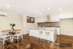 1/4 MOUNTAIN ASH AVENUE ASHWOOD VIC 3147 A brand new street-front town residence has become available in Ashwood showcasing luxurious proportions, sublime finishes and exceptional functionality. Encompassing elements and carefully considered details, this residence provides a unique dual zoned layout flowing from a light-filled lounge, a spacious open plan living/dining zone and high-end galley-style kitchen boasting stone surfaces, Bosch appliances and walk-in pantry. Enjoy the versatility of ground floor and first floor main bedrooms, each with a designer ensuite, complemented by 2 further robed bedrooms, teenage retreat and stylish fully-tiled bathroom. Split system heating/AC, powder room, alarm system, video intercom, timber floors, entertaining courtyard and double garage are amongst the additional assets of a home certain to establish a new benchmark. Located for lifestyle convenience, close to Ashwood College, Parkhill Primary, Gardiners Creek parkland, Ashburton Village, Chadstone Shopping Centre and transport.