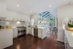 50 Somers Street Burwood VIC 3125 Stylishly renovated grand proportions and a magnificent 1,176sqm corner garden allotment with heated pool create an unforgettable family lifestyle sanctuary in this landmark five bedroom home, one of the PLC precinct's finest family offerings. Built by the neighbourhood's original builder for his own family on the area's most prestigious "crest of the hill" double parcel, its harmoniously extended solid brick dimensions now blend early c.1950's originality with classic modern style, complete contemporary function and stunning indoor/outdoor entertaining spaces. Enjoyed in absolute privacy surrounded by its high fenced established gardens, multiple living and entertaining areas are all linked by an impressive central entertainers' kitchen featuring elegant stone benchtops, family sized smeg appliances and a deep WIP. North facing open plan family spaces slide back to incorporate a spectacular poolside entertaining pavilion complete with outdoor smeg kitchen, stone island dining, strip heating and Zipscreen blinds for all weather enjoyment. Upstairs, an equally irresistible main bedroom with WIR/ensuite enjoys its own separate sitting/retreat with extensive storage accompanied by three additional bedrooms with BIRs, a landing rumpus/study domain, designer bathroom and sun patio. A long list of other highlights includes formal sitting with OFP, downstairs double bedroom/study with BIRs, powder room, heated pool/spa, high ceilings, timber floors, ducted gas heating and reverse cycle air conditioning, auto garden irrigation, remote double garage plus gated OSP x2. Short walk to independent schools including PLC, Wattle Park Primary and Deakin University, Wattle Park, buses to Chadstone and Box Hill Shopping Centres, Toorak Road trams, shops and cafes.