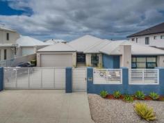 12 Whitehorses Drive Burns Beach Burns Beach WA 6028 $950,000 A 5-minute walk down to the beach and in close proximity to the Burns Beach Caf hotspot and miles of pathways for walking or cycling while taking in the breathtaking sea views this coastline offers, what more could a you ask for! This home is so easy to maintain that it feels like you are on holiday every day. A stone aggregate driveway and frontage creates a lovely courtyard that is fully fenced and boasts electric gates. The double garage has roller door access to the back yard. A Double door entry welcomes you into the foyer, the convenient shopper's entrance to the left and a short passageway to the right, leads to a separate wing of the house boasting 3 bedrooms all with built in robes. Two of the rooms are queen size and the 3rd a luxurious king size. All bedrooms have ceiling fans, a blessing on those hot summer nights. A spacious guest w/c with vanity is situated next to a ginormous walk-in linen closet which is across from a vast double door cupboard - this home is not short on storage space! The teen retreat / study zone has the facility to plumb in hot and cold water enabling a kitchenette to be built creating a granny flat if desired. The family bathroom is tiled from floor to ceiling and boasts a 3rd w/c. The decor and finishes are all neutral and stylish, pure understated elegance. Through double French doors into the open plan kitchen, dining and sitting rooms you will find the ample galley styled kitchen with 3 modern stainless-steel pendants hang over the Corian seamless bench top. Ample cupboards with an integrated Miele dishwasher, a 900mm gas hob, space for a double door plumbed in fridge and a massive walk in pantry with power points. The modern laundry is accessed from the kitchen and has sliders out to the courtyard. The media room is enormous and comes complete with a projector and huge screen, easily closed off from the rest of the house. Movie buffs will surely be impressed. The master suite is last but not least - king sized luxury with walk in robe, a slider out to a courtyard, also boasting a beautiful en-suite with a large slipper styled bath, floor to ceiling tiles and dual vanity, the epitome of sumptuous living. A perfectly sized study or parents retreat is a great compliment to this adult space. The outdoor alfresco area is just as impressive with a built in BBQ, stainless steel bench, sink and cupboards. Concrete pavers and effective gauze blinds that keep the sun and strong breeze at bay. The glass enclosed pool has a gentle waterfall adding to the tranquillity. The open plan living area has full views out to the pool area to keep an eye on the little people. This is the perfect home for large families, extended families, professional couples or even down sizers looking for the ideal beach side location and travel lifestyle which offers separate space for visiting family and friends. Some of the impressive features are: • Inground, salt chlorinated, concrete pool with solar heating. • Reverse cycle, zoned air con • Fully alarmed • Trunk wiring in media room for network access • 3 phase power • Blackbutt engineered timber flooring throughout living areas • All bedrooms carpeted. • Rheem instant hot water • Additional plug sockets in laundry as well as pantry. • Secure parking for 4 cars.