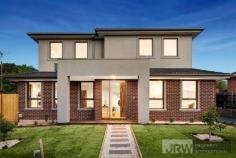 1/4 MOUNTAIN ASH AVENUE ASHWOOD VIC 3147 A brand new street-front town residence has become available in Ashwood showcasing luxurious proportions, sublime finishes and exceptional functionality. Encompassing elements and carefully considered details, this residence provides a unique dual zoned layout flowing from a light-filled lounge, a spacious open plan living/dining zone and high-end galley-style kitchen boasting stone surfaces, Bosch appliances and walk-in pantry. Enjoy the versatility of ground floor and first floor main bedrooms, each with a designer ensuite, complemented by 2 further robed bedrooms, teenage retreat and stylish fully-tiled bathroom. Split system heating/AC, powder room, alarm system, video intercom, timber floors, entertaining courtyard and double garage are amongst the additional assets of a home certain to establish a new benchmark. Located for lifestyle convenience, close to Ashwood College, Parkhill Primary, Gardiners Creek parkland, Ashburton Village, Chadstone Shopping Centre and transport.