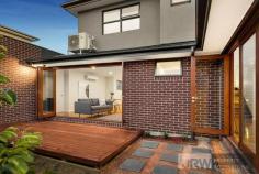 1/4 MOUNTAIN ASH AVENUE ASHWOOD VIC 3147 A brand new street-front town residence has become available in Ashwood showcasing luxurious proportions, sublime finishes and exceptional functionality. Encompassing elements and carefully considered details, this residence provides a unique dual zoned layout flowing from a light-filled lounge, a spacious open plan living/dining zone and high-end galley-style kitchen boasting stone surfaces, Bosch appliances and walk-in pantry. Enjoy the versatility of ground floor and first floor main bedrooms, each with a designer ensuite, complemented by 2 further robed bedrooms, teenage retreat and stylish fully-tiled bathroom. Split system heating/AC, powder room, alarm system, video intercom, timber floors, entertaining courtyard and double garage are amongst the additional assets of a home certain to establish a new benchmark. Located for lifestyle convenience, close to Ashwood College, Parkhill Primary, Gardiners Creek parkland, Ashburton Village, Chadstone Shopping Centre and transport.