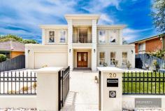 20 HEADINGLEY ROAD MOUNT WAVERLEY VIC 3149 Radiating refined elegance, this indulgent double storey residence blends its opulent scale with lavish fittings and quality craftsmanship to create a home like no other in the sought-after Mount Waverley Secondary Zone. Inspiring easy living, decedent double doors open to reveal a lengthy entrance hall that draws you past the study, formal lounge and private theatre room all adorned with comforting carpet. Graced by glamorous floorboards, the indulgent kitchen, meals and family room showcases waterfall stone benches, a window splashback, high-end cabinetry and appliances, a desired 2nd kitchen plus a convenient breakfast bench. Connecting to this space, entertainer's will appreciate the inclusion of a covered alfresco entertaining zone with outdoor kitchen set-up, while the low-maintenance backyard presents space for children to play. Ensuring the family's every desire is met, the upper level comes with a wonderful retreat/living room and hosts four of the five bedrooms (all with walk-in-robes and individual ensuites), including the master with concealed robes, balcony and lavish ensuite, further complemented downstairs by a guest bedroom with walk-in-robe and ensuite, laundry and powder room. Highlighted by ducted heating, refrigerated air conditioning, alarm, high ceilings, gated driveway access plus a double garage with internal access.