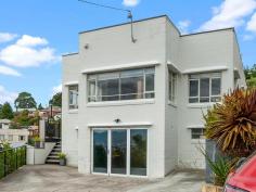 7 Dumas Place Moonah TAS 7009 $545,000 From the moment you arrive you know this home has that little something special. 7 Dumas Place Moonah is 123 M/2 of solid brick construction and is perfectly positioned on a 673 M/2 Allotment. Inviting to the eye you enter the property via a short flight of stairs onto a terrace style deck capturing all day sun and perfect for entertaining or admiring the panoramic views. The deck extends onto a perfectly level, secure and low maintenance garden. Steps also lead down to a lower garden with the most magnificent walnut tree. You enter the home from the deck into a central hallway. Off to the side is a light and sunny formal lounge with high ceilings and great views. One of the homes outstanding features is the perfect polished floorboards in each room. There is a separate dining and modern kitchen with white gloss joinery, granite bench tops and quality appliances. The home has 3 bedrooms in total with full length built-ins to the master. The family bathroom is modern and comes with shower enclosure, vanity unit and toilet. Towards the back door is a full height window bringing the outside garden inside. This flows onto the second bathroom with full length bath and incorporates the laundry. Down stairs has parking for 3 cars at street level and access to a large utility room and storage area via full height glass doors. This area is perfect for hobbies, workshop or guests to stay. Interesting feature is the vintage tram spiral stairs leading to the linen cupboard above. This tastefully styled home is truly one of a kind and is minutes away from the central hub of Moonah. Transport, shops, cafes and shopping centres are only walking distance away. It's real hard to find a property more central like this one and being only 15 Minutes (Approx.) away from the Hobart CBD. This one truly has it all. Call to book in your inspection today of come to one of our scheduled open homes.