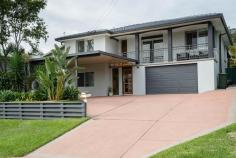 6 Murray Street Eleebana NSW 2282 $655,000 - $695,000 This sensational family home with northerly aspect has been totally refurbished with all the modern comforts that you deserve. If you think it looks great on the outside, you will be blown away on what's inside. From the formal entry right through to the extra-large alfresco entertainment area nothing has been spared. Floating timber floors and air-conditioned comfort in the living areas, soft quality carpets in the three bedrooms and the multi-purposed room downstairs plus modern shutters and venetians. Well there are kitchens and then there are kitchens. This one steals the show with a generous island bench, stainless steel appliances, soft close cupboards and draws and is the focal point of the home. It has easy access to the extra-large alfresco for fun with friends and a casual dining for family dinners. If that's not enough the vogue bathroom looks like its straight out of a glossy magazine and will blow your socks off. Nestled on a near level kid-safe block it's the perfect spot to raise a family. Great garaging for three cars or even that boat you've always wanted as its only 600m to the boat ramp.