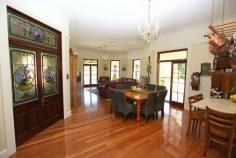 20 BYRNE LANE MALENY QLD 4552 $2,600,000 This luxury Maleny home offers a superior standard of construction, quality timbers, antique leadlight windows, solid Australian Red Cedar doors and selected features that once graced Brisbane's Petrie Mansion. No inferior materials or chipboard whatsoever. A spacious entry foyer, four large bedrooms, three bathrooms, huge formal and informal living areas, a classic country style all timber kitchen, billiard room, wide hallway, 11 foot decorative ceilings, pure wool English carpet and recycled hardwood flooring throughout. Wide verandahs surround the home and there is a large rotunda for outdoor dining. Sweeping level lawns, tall pines, feature shrubs and trees, manicured garden beds, circular driveway with feature fountain and pool. There's a 65 x 35 foot shed, and the backdrop of Mary Cairncross Rainforest Reserve adds to the charm and appeal of this unique sanctuary. A once in a lifetime opportunity to discover the beauty and comfortable year round climate of this magnificent area at below replacement cost.