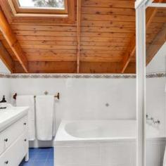 117 Evans Lookout Rd, Blackheath NSW 2785 $895,000 On a 1063m2 block and only 3km from Blackheath Village, this home has a lot to offer. Featuring a 6 person outdoor spa, cosy timber panelling, charming leafy views throughout, a self-contained studio with garage, wood fire, and large bedrooms with plenty of storage, this property is both spacious and versatile, making it a very appealing option to a broad market. Whether you're looking for a large family home, room for entertaining guests, investment potential, or space to work from home, this property has you sorted. Hamptons style home with timber panelling throughout 5 spacious bedrooms with storage Cosy lounge room with combustion wood fire, and other heating options throughout Leafy views throughout, with bush-inspired garden offering plenty of entertaining space 3km from Blackheath Village Plenty of communal living space Country-style kitchen with charming timber benchtops Sitting on a 1063m2 block 4 bathrooms Character-filled raked ceilings Separate self-contained studio or parents' retreat with garage