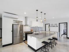 2-14 Acacia Court Beechmont QLD 4211 $870,000 In the heart of Beechmont surrounded by the lush vegetation of the Scenic Rim you will find this contemporary 3.18 acre, one of its kind property. With a blend of sophistication and elegance this property offers country living with a city feel. Built to the highest standard, the main residence is architecturally designed with 4 spacious bedrooms, 2 bathrooms and a kitchen any budding cook would love. Also on offer is a huge garage built with the same design as the house, which will fit up to 6 cars. Attached to this is a fully self contained one bedroom dwelling also designed to compliment the features and design of the main house. Other features include: Electric front gates Fully fenced on all boundaries Bore with pump up to 2 large in-ground water tanks Air-conditioners throughout Marble tiles in bathrooms Gas cooking Circular gravel driveway 10m x 8.4m carport / undercover entertaining area Large windows overlooking views Gas fireplace Large laundry
