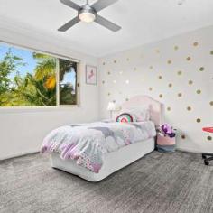35 Timbertops Dr, Coffs Harbour NSW 2450 $995,000 Set amongst prestigious homes and just minutes walk to one of our regions best surfing beaches, this stunning family home is sure to impress. 3 spacious living areas provide a choice between formal or relaxed living and the elevated entertaining deck over looks the sparkling in-ground saltwater pool and established private gardens. The home chef will appreciate a well eqquipped kitchen complete with stone benchtops, glass splashback, gas cooking and loads of storage. This area forms the central hub of the home and flows to both the dining and living room with polished timber floors and high ceilings. The upper level is a genuine parents retreat boasting an oversize master bedroom, ensuite with spa bath and dual shower, plus a living room and sun deck all with ocean views. This is the prefect spot to unwind and relax away from the kids. Each of the 5 bedrooms feature reverse cycle air conditioning, large built in robes and are smartly positioned to provide privacy and easy access to the main bathroom. The man of the house will rejoice at the huge 4 car garage, plus there's a dedicated parking pad for your trailer with a secure gate.