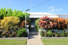 5 Clement St Ayr QLD 4807 $249,000 Tucked away neatly in a quiet part on Rossiter's Hill is this "PICTURE PERFECT" 3 bedroom low set family home on a 809m2 town block. Stunning lush gardens invite you further to investigate what lies within. Combined airconditioned living & dining with gleaming timber floors upon entry from the tiled front patio. Tidy kitchen with ample bench, prep & storage space. Down the hallway you will come upon this homes bathroom amenitites which are conveniently located near the 3 bedrooms sporting timber floors, airconditioning, fans & 2 with built-ins. Internal laundry with storage & a handy 2nd toilet. Venture outside into the stunning gardens which have sprinklers & irrigation in place. Carport parking for one on the left & double parking through the auto rollerdoor on the right with drive through access to the block "MANCAVE" outback which is powered with loads of room for hubby's extra's...An abundance of exotic fruit trees including citrus, mulberry, custard apple, mangosteen & more. Dot the backyard with lush grass & foliage to create the most peaceful setting. This family home is a great place to start so arrange your immediate inspection today. You won't want to miss out.