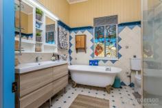 9 Albury Street Deagon QLD 4017 $499,850 For the first time in two decades, “Torpies Cottage”, is being presented to the market; circa early 1900’s this highset Queensland-style home, arguably Deagon’s most iconic, has a proud history, built by businessman and local pioneer Thomas Torpie…this gracious old Queenslander has been an attractive, traditional fixture on the changing Deagon landscape. Beautifully restored and maintained by its current owners of 20 years; the home features all the period features that make this vintage of property so beloved and charming, including 10-foot high ceilings, VJ walls, decorative cast iron on verandas, claw foot bath, timber floors, French doors, original windows, dado rails, fretwork, and stained-glass insets. With the living all on the upper level and an expansive workspace/storage area under, the home is complete with three or four bedrooms, one-bathroom, large timber kitchen with stainless steel 900mm Lofra gas cooktop and oven, two separate living areas plus office workspace/salon/4th bedroom, front and rear covered decks, and a delightful fully air-conditioned, powered, and enclosed outdoor gazebo. The block is fully fenced with a picket fence at front plus side access through to backyard, and cemented pad to park two cars in tandem; there is a paved area at front of home for a third car and grassy child/pet friendly yard at rear. Mr Torpie was a grocer and an active community-minded citizen; he lived in this home he built beside his first shop in Deagon for many years before it was eventually sold to a private buyer. It still has all the charm, warmth and grace of yesteryear, whilst offering comfortable living with all the contemporary essentials. The integrity of this truly special home has not been compromised over time…it remains a shining example of the quality and timelessness of its era. Located within walking distance to the train station connecting you straight into Brisbane’s CBD, and just a short drive to Sandgate foreshore, 13 minutes’ drive to Brisbane Airport, and approximately 27 minutes into the city centre; major amenities, employment and educational hubs are easily accessed. Current owners have been blessed to call this home their own for twenty years, their haven; now it’s time for someone else to embrace “Torpies Cottage” and create their own cherished memories and continue the tradition… FEATURE POINTS WE LOVE: • Iconic Deagon home, circa early 1900’s • ‘Torpies Cottage’, beautifully presented • Highset Queenslander with a proud history • 3 or 4 bedrooms, 1 bathroom, plus study or 4th bed • 2 separate living areas + enclosed gazebo • Large timber kitchen, Lofra gas cooktop & oven • Front & rear deck, decorative cast iron • 10-foot ceilings, timber floors, French doors • Claw foot bath, VJ walls with picture rails, original windows • Air-conditioning, storage/workshop under • Tandem parking for 2 cars + another single car & side access • Fully fenced low maintenance block • Walk to rail to CBD, 13 mins to Airport • Traditional period home, charm shines • Current owners have held for 20 years!