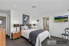 5 BELSAY CHASE CHIRNSIDE PARK VIC 3116 $600,000 - $660,000 Set apart from the rest, this newly developed architecturally designed sanctuary is a spectacular example of contemporary suburban living. Over two levels and highlighted by a spacious lounge and dining zone, flexible upstairs retreat, and terrific low maintenance Zen courtyard. This picturesque and peaceful property is at the gateway to the Yarra Valley and only a stone's throw from wonderful Chirnside Park attractions including schools such as Oxley College, parks and Chirnside Park Shopping Village which is within only walking distance! Awash in superb natural light and owning superior fittings and fixtures throughout, this generous family haven exudes warmth. Showcasing an enormous rear living zone, with a meals area enjoying exquisite pendant lighting, and access to the easy-care alfresco area through the breezy double doors. The vogue kitchen has shimmering black stone surfaces, an island bench and quality stainless steel gas appliances, while the additional upper level retreat is brilliantly flexible. The master suite features full-length windows allowing an abundance of natural light as well as a walk-in robe and immaculate ensuite, captivating with a deep freestanding bath tub. The two other bedrooms own robes and a shared balcony and neighbour the pristine, fully tiled central bathroom with a wall-to-wall shower. Also enjoying a sleek powder room, under stairs storage, ducted heating, evaporative cooling, tinted windows, split system units, LED down lights, low maintenance tiling throughout bottom level, security doors at front and rear, a laundry with access to the remote garage.