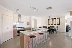 2 Ritaco Way Hidden Valley VIC 3756 $720,000-$770,000 With parkland front and rear of the property, this house has a great feeling of space and peace and quiet. Four good sized bedrooms plus a study/parents retreat make it ideal for a large family. The master suite will spoil the parents with a his-and-hers walk-in robe, double vanity and a double shower. The other three bedrooms are all of a good size and have BIRs. The family hub is vast and encompasses a formal living area, a large kitchen-meals-living area, that includes a real-flame log fire. This in turn leads out to the first covered alfresco areas. The kitchen features an island bench, stone tops, stainless steel appliances, 900mm stove, and a large fridge space with plumbing. The other living area leads through bi-fold doors to the other alfresco area and the large level grassed and landscaped rear yard. There is also plenty of side access for a caravan or trailer or extra off-street parking. Other features include NBN, solar panels, ducted heating, ducted cooling, security cameras, fire pit, outdoor cafe blinds and ceiling fans. Join the Hidden Valley community, with its brand new Country Club, which includes restaurants, heated-indoor swimming pool, gymnasium, equestrian centre, horse riding trails, pro shop and the Craig Parry designed 18 hole golf course with no body-corporate fees.