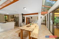 61 Symons Ave Boambee NSW 2450 $799,000 - $859,000 Once in a while you find a home that's surprisingly different & a pleasure to inspect. This sun-drenched corner of the Boambee Valley is the location of this uniquely designed, split level family home.The strategically planted gardens offer complete privacy from the street and neighbours, creating a relaxing environment to come home to.Stepping inside you find a home full of light with a serene green outlook from every window.Set on just under 2 acres, you will find the maintenance is surprisingly low, as most of the land has been left in its natural bush/rainforest state.A level grassed area around the home is perfect for kids to play & there is plenty of space for a pool just off the living & undercover entertainment area.The updated kitchen is central to two living and two dining areas.Each living space is heated by a slow combustion fireplace - creating a cosy ambience in the cooler months.An extra powder room is a handy addition for the busy family, as is the study nook off the main family room area.The master bedroom suite is situated in the loft away from the rest of the home, and has it's own study/retreat, or possibly a nursery attached.A possible 5th bedroom could be easily created by converting the formal dining room. Professional people, young families and couples alike would all appreciate the serenity & space this property offers.Situated in a quiet cul-de-sac within a short drive to local shops, schools & beaches.Conveniently less than 10 mins to Airport, Sawtell beachside lifestyle & the Coffs Harbour CBD.