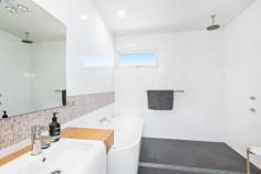 221 Mitchell Street Stockton NSW 2295 With only two streets in Newcastle offering unobstructed beachfront locations, rarely does the opportunity arise to purchase such a unique lifestyle property. This outstanding residence, first occupied in 2014 and designed by Sydney Architects May + Swan, with a brief for maximum energy efficiency, wheelchair friendly access and most importantly making the most of the glorious beach views opposite, from Fingal lighthouse to the harbour entrance Just a short 5 minute ferry ride or 20 minute drive from Newcastle's CBD, Stockton has become one of the Region's most sought after lifestyle suburbs with its surf clubs, 8km of level cycleways, the city's largest foreshore parkland, recreational facilities and village like environment. This is an opportunity to own an extremely desirable home, in one of the Newcastle's most liveable suburbs not to be missed. 4 Bedrooms with option for a 5th Main suite presents with ensuite, dressing room and parents retreat/studio/gym area overlooking the ocean. Open plan kitchen with quality European appliances, huge meals area and family/living room with built in library wall and Jetmaster open fireplace. Large separate home theatre or media room which has ability to be split in two Stunning bathrooms, beautifully designed to suit today's lifestyle. Huge laundry with two walls of cupboard storage space. 3 Car lock up internal access garaging with extra high doors and spacious mezzanine storage. Spotted gum hardwood floors and wide hallway doors and floating external decking designed for easy wheelchair accessibility. Three camera security system Four 3000lt rain water tanks and solar hot water system with gas instantaneous back up incorporating twenty solar panels Two spacious timber entertainment terraces including one at the front overlooking the Pacific Ocean.