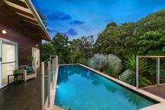 5 Glen Road Mons QLD 4556 Get the privacy and space you've desired whilst still having all the convenience of a top class Buderim location. Set in an elevated position on a large three plus acres of desirable land, this secluded, tropical oasis will certainly set you up well financially for the future. With high raked ceilings, exposed timber beams and polished hardwood floors, this stylish home perfectly marries modern comforts with a homely feel. Expansive decks surround the home connecting the the living spaces and master bedroom with the large 11 metre lap pool, providing the perfect environment to soak up the serenity of this stunning property. Sweeping bitumen driveway opens to reveal a private bush setting Potential to set up for horses Centrally located kitchen with gas cook top & Caesar stone bench top Separate, large lounge/media room plus fourth bedroom/home office Master with walk-in robe, private deck access & stylish ensuite Split system air-conditioning, fireplace in lounge Under house workshop & storeroom next to large carports Located in a premium pocket of Mons surrounded by high quality homes Level lawn area adjoining home, plenty of room to build a tennis court if desired 4kw solar power, 45,000L rainwater tank, water bore & dam Close to Sunshine Coasts best schools, University, Buderim Village & Bruce Highway access