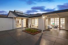Unit 2/27 Young St, Seacliff SA 5049 Kiss 1983 goodbye and while you're there, dismiss that strata label; there's no surface, inch or entertaining square metre not subjected to contemporary style in a 3-bedroom, 2-bathroom homette all for seaside chic. Seaside meaning a 200m salute to the sand and popular BBQ hotspot/playing park of Angus Neil Reserve, and chic the only word to describe an overhaul of designer home proportions. In a double-brick build reborn thanks to newly rendered and painted exteriors, a restored and repointed roofline, resurfaced driveway, new porch tiling and easy-care gardens. Where entertaining is now the main event; its pergola and deck forming an outdoor room seeing friends swish in and out via the double door thoroughfare from the open plan living space. Subway tiled splashbacks, stainless appliances, soft-close storage and immeasurable stone benchtops give the spacious new kitchen the social kick it rightly deserves, accented by the subtle greys and soft whites of its fresh dcor, LED lighting and sand-tolerant tiles drifting throughout. Until its 3 carpeted bedrooms and hallway come along - the master blessed with an all-new en suite (the first of 2 bathroom renovations) and a walk-in robe, suitably fitted with hanging storage scaled for a much larger slice of real estate Enjoy economical solar hot water, ducted evaporative cooling throughout, split system heating and cooling and powered skylights. Even an outdoor shower (with a hot or cold rinse) welcomes your return from the beach. And according to strata, pets can stay, while no strata fees apply; park the car, pace the esplanade from Seacliff to Brighton, explore Kingston Park Coastal Reserve or wander Jetty Road's cafes and boutiques. You only live once; make it worthwhile in a spectacular seaside entertainer.