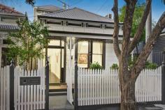 21 Bowen Street Prahran VIC 3181 The picturesque block fronted façade of this freestanding Victorian residence creates an irresistible first impression that is matched by impeccable interior spaces. Combining evocative period charm and sophisticated contemporary style, this welcoming home is situated on a charming heritage streetscape. Featuring timber floors and high decorative ceilings, the refined living room with open fireplace is complemented by open plan living and dining with study nook and adjoining gourmet kitchen boasting stone benches, Gaggenau oven, Miele gas cooktop and integrated dishwasher. Expanses of glass allow plenty of northern light to stream through, with a landscaped courtyard providing options for entertaining and dining. The generous main bedroom enjoys expansive robes, balcony and stylish ensuite, while two additional bedrooms with robes share a family bathroom. Includes wine and attic storage, garage with laundry and rear ROW. Moments from High and Chapel Streets, transport and schools.