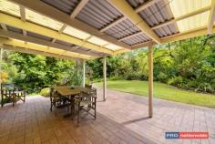 61 Symons Ave Boambee NSW 2450 $799,000 - $859,000 Once in a while you find a home that's surprisingly different & a pleasure to inspect. This sun-drenched corner of the Boambee Valley is the location of this uniquely designed, split level family home.The strategically planted gardens offer complete privacy from the street and neighbours, creating a relaxing environment to come home to.Stepping inside you find a home full of light with a serene green outlook from every window.Set on just under 2 acres, you will find the maintenance is surprisingly low, as most of the land has been left in its natural bush/rainforest state.A level grassed area around the home is perfect for kids to play & there is plenty of space for a pool just off the living & undercover entertainment area.The updated kitchen is central to two living and two dining areas.Each living space is heated by a slow combustion fireplace - creating a cosy ambience in the cooler months.An extra powder room is a handy addition for the busy family, as is the study nook off the main family room area.The master bedroom suite is situated in the loft away from the rest of the home, and has it's own study/retreat, or possibly a nursery attached.A possible 5th bedroom could be easily created by converting the formal dining room. Professional people, young families and couples alike would all appreciate the serenity & space this property offers.Situated in a quiet cul-de-sac within a short drive to local shops, schools & beaches.Conveniently less than 10 mins to Airport, Sawtell beachside lifestyle & the Coffs Harbour CBD.
