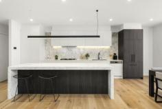 3/39 Caroline Street Aberfeldie VIC 3040 $1,290,000 An enviable position within the prestigious Maribyrnong River precinct sets the scene for family luxury at this brand new four bedroom, three bathroom executive residence. Servicing a vast open living domain with entertaining deck is a kitchen designed for the culinary enthusiast. Waterfall stone counters highlight 900mm appliances, dishwasher by Smeg, integrated Fisher & Paykel refrigeration and stone splashback. Four double robed bedrooms access three deluxe fully tiled bathrooms, main with freestanding bath. All feature a split system air conditioner for personalised comfort. Confirming ultimate convenience, both floors present a radiant master boasting WIR/ensuite. Outstanding extras include a quiet study alcove, video intercom, security alarm, double glazed windows, powder room (fourth toilet), stone bench tops throughout, even in a storage packed laundry and a remote controlled garage with internal access.