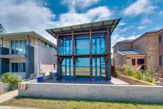 221 Mitchell Street Stockton NSW 2295 With only two streets in Newcastle offering unobstructed beachfront locations, rarely does the opportunity arise to purchase such a unique lifestyle property. This outstanding residence, first occupied in 2014 and designed by Sydney Architects May + Swan, with a brief for maximum energy efficiency, wheelchair friendly access and most importantly making the most of the glorious beach views opposite, from Fingal lighthouse to the harbour entrance Just a short 5 minute ferry ride or 20 minute drive from Newcastle's CBD, Stockton has become one of the Region's most sought after lifestyle suburbs with its surf clubs, 8km of level cycleways, the city's largest foreshore parkland, recreational facilities and village like environment. This is an opportunity to own an extremely desirable home, in one of the Newcastle's most liveable suburbs not to be missed. 4 Bedrooms with option for a 5th Main suite presents with ensuite, dressing room and parents retreat/studio/gym area overlooking the ocean. Open plan kitchen with quality European appliances, huge meals area and family/living room with built in library wall and Jetmaster open fireplace. Large separate home theatre or media room which has ability to be split in two Stunning bathrooms, beautifully designed to suit today's lifestyle. Huge laundry with two walls of cupboard storage space. 3 Car lock up internal access garaging with extra high doors and spacious mezzanine storage. Spotted gum hardwood floors and wide hallway doors and floating external decking designed for easy wheelchair accessibility. Three camera security system Four 3000lt rain water tanks and solar hot water system with gas instantaneous back up incorporating twenty solar panels Two spacious timber entertainment terraces including one at the front overlooking the Pacific Ocean.