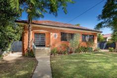 643 Lester St, Albury NSW 2640 Perfectly positioned on the high side on Lester Street, only a few blocks to Alburys' CBD this solid red brick, 2 bedroom home has loads of charm. Inside, you will find the charming features of a home of this era. Enter through the double doors from the inviting north facing porch into the light filled dining room and near new modern kitchen. With Murray Pine floorboards throughout, the lounge room features a cosy open fire, whilst the large master bedroom has built in robes. There's a second bedroom and bathroom with claw foot bath and separate shower. Outdoors you'll find a private secure yard, with paved area and a shady, terraced grassed area with a water feature. The large 6m x 10m x 3.6m high shed has power and WC, plus a 6m x 3.4m mezzanine, air conditioning and a ceiling fan. This area could easily be converted to studio accommodation or suit a home business. This home would suit the downsizer, a small family, investor or the renovator. With a 640m2 block, the potential is obvious!