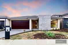 16 Wenn Avenue, Clyde North VIC 3978 A reflection of crisp modern style, this brand new family home sets a benchmark in easy living with its smooth interaction of casual living and indoor entertaining, while a wonderful alfresco zone spans out onto the backyard for effortless summertime BBQs. Beyond its striking facade, the home with its impressive high ceilings takes you through to a spectacular kitchen, living and dining zone that's adorned with stone benches, mirrored glass splashback, stainless steel appliances, 900mm gas cooktop, a dishwasher plus a walk-in pantry. The adjacent rumpus room creates a relaxed space for entertaining during the cooler winter months, while a superb alfresco zone extends freely onto the low-maintenance backyard. Carpet adds additional comfort throughout the four robed bedrooms; master with walk-in-robe and dual vanity ensuite, accompanied by a family bathroom with floor-to-ceiling tiling and separate toilet. Furthermore, the home boasts a laundry/butler's pantry, ducted heating, evaporative cooling plus a double garage with internal access. Conveniently placed, close to St Peter's College, Clyde Primary, St Thomas the Apostle Primary, Eden Rise shops, Casey Central, buses, trains plus major arterials.