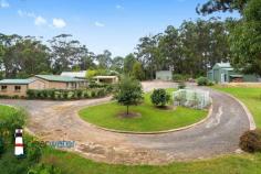 10 gibboketon Pl Wallaga Lake NSW 2546 $639,000 "Asmara" - Situated on a generous 4581 m2 block of land backing onto bushland, this single level three bedroom, two bathroom home has a lot to offer and is only a short walk to the lake and beach. Features: Open plan design with slow combustion wood heater, large master bedroom with ensuite, two additional good sized bedrooms, bathroom, rustic kitchen and a huge sunroom at the rear. From the sunroom, you enter a fenced area which is ideal for family pets. The covered alfresco barbecue area is up a couple of steps and next to a single garage. The front yard is level with nice grass areas and minimal gardens. Garages: At the rear of the property is a 12m x 12m American Style Barn with three roller doors. The centre door is high and ideal for boat storage. The large single garage next to the house has plenty of workshop space and the other single garage near the barbecue area is ideal for storing items for your family gatherings. Location: This quiet, friendly neighbourhood backs onto bushland and is within an easy walk to Haywards's Beach, Wallaga Lake and many good fishing spots. The beach has a large section that is dog friendly. A short drive into Bermagui and even more pristine beaches, ten minutes to Central Tilba with its many specialty shops and cheese factory. Rent Back: The vendor is downsizing and would like to rent back for a few months or discuss renting the large shed at the rear to allow him time to move into his new property.