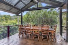 176 White Patch Esplanade, WHITE PATCH QLD 4507 | Madeleine Hicks Real Estate Brisbane There are only a limited number of waterfront properties and your acreage beach hideaway is hidden amongst the gum trees, only two doors from the Bribie Island Recreational Park. The environment is not only special but unique and here you will find your charming Polynesian Style home. Character, soaring ceilings, polished floors, wide deck a truly idyllic property located in a natural Australian bush environment with the sparkling sun kissed Pumicestone Passage at your front door. With 2023 square meters fully fenced lot, it is perfect for children and pets to enjoy. There is plenty of room for “toys” in the 3 huge sheds plus bonus plumbed-in shed with kitchen facilities. Life on the esplanade is tranquil with visits from the local kangaroo and wallaby families, occasional brumby and other local wildlife. It is a pleasure to sit on the deck and gaze over at the shimmering passage while only a few minutes’ drive to Banksia Beach Shopping Centre, Banksia Beach Primary School, Pacific Harbour Golf and Country Club, Solander Lake Bowls Club and much more. You will LOVE: – Potential for granny flat – 2 bedrooms plus office or nursery – Ensuite – Solar 3kw – Fire place – 4 car accommodation – Open plan living – Side access – Light filled living – Huge SHED Ask Madeleine and Kerry today to make this hidden gem yours before someone else does. Land: 2023 m² Bedrooms: 2 Bathrooms: 2