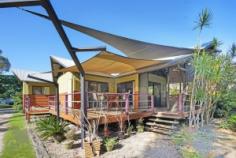 176 White Patch Esplanade, WHITE PATCH QLD 4507 | Madeleine Hicks Real Estate Brisbane There are only a limited number of waterfront properties and your acreage beach hideaway is hidden amongst the gum trees, only two doors from the Bribie Island Recreational Park. The environment is not only special but unique and here you will find your charming Polynesian Style home. Character, soaring ceilings, polished floors, wide deck a truly idyllic property located in a natural Australian bush environment with the sparkling sun kissed Pumicestone Passage at your front door. With 2023 square meters fully fenced lot, it is perfect for children and pets to enjoy. There is plenty of room for “toys” in the 3 huge sheds plus bonus plumbed-in shed with kitchen facilities. Life on the esplanade is tranquil with visits from the local kangaroo and wallaby families, occasional brumby and other local wildlife. It is a pleasure to sit on the deck and gaze over at the shimmering passage while only a few minutes’ drive to Banksia Beach Shopping Centre, Banksia Beach Primary School, Pacific Harbour Golf and Country Club, Solander Lake Bowls Club and much more. You will LOVE: – Potential for granny flat – 2 bedrooms plus office or nursery – Ensuite – Solar 3kw – Fire place – 4 car accommodation – Open plan living – Side access – Light filled living – Huge SHED Ask Madeleine and Kerry today to make this hidden gem yours before someone else does. Land: 2023 m² Bedrooms: 2 Bathrooms: 2